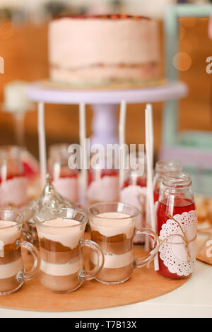 Yummy birthday cake and drinks on table. Stock Photo