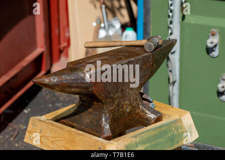 Old anvil and hammer ready for blacksmith Stock Photo