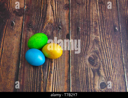 Beautiful colorful Easter eggs. Easter concept on dark wooden background Stock Photo