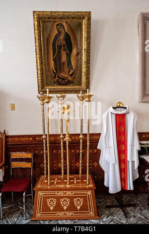 Priests vestments in the sacristy at the Parroquia de Nuestra Senora de la Asuncion or parish of Our Lady of the Assumption church in Jalostotitlan, Jalisco State, Mexico. The parish church was built in 1622 from rose quarry stone called cantera rosa. Stock Photo