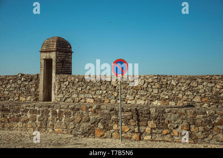 NO WAITING road sign in front of thick wall made of rough stones with small watchtower at Marvao. A medieval hamlet perched on a crag in Portugal. Stock Photo