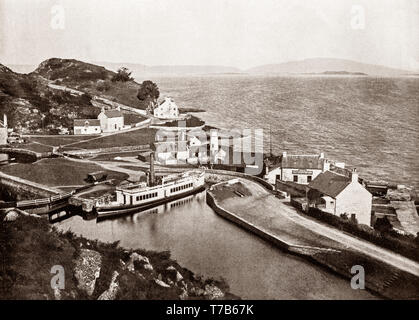 A late 19th Century view of the tiny harbour at Crinan,  a small village located on the west coast of Scotland in the region known as Knapdale, which is part of Argyll and Bute. Before the Crinan Canal was built, Crinan was named Port Righ which meant the king's port. The canal was named from the small settlement of Crinan Ferry on the edge of Loch Crinan where a small ferry landed and designed to provide a short cut between the west coast and islands at one end and the Clyde estuary at the other, and so avoid the long voyage around the south end of the Kintyre Peninsula. Stock Photo