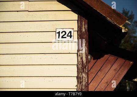 A number of house in the suburbs. House with plastic boards and a roof made of corrugated sheet Stock Photo