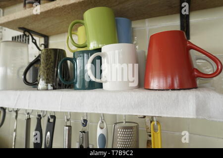 Coffee cups on shelf. Stock Photo