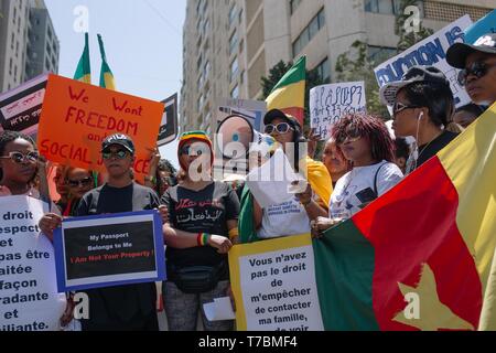 Protesters are seen holding placards during the demonstration. Hundreds of people from different nationalities marched to protest for the rights of migrant workers, shouting slogans and holding banners calling for the abolishment of Lebanon’s controversial kafala sponsorship system. Stock Photo
