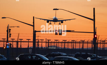 Richmond, British Columbia, Canada. 4th May, 2019. Anarrow-body Airbus jetliner, silhouetted by the setting sun, lands at Vancouver International Airport. Credit: Bayne Stanley/ZUMA Wire/Alamy Live News Stock Photo