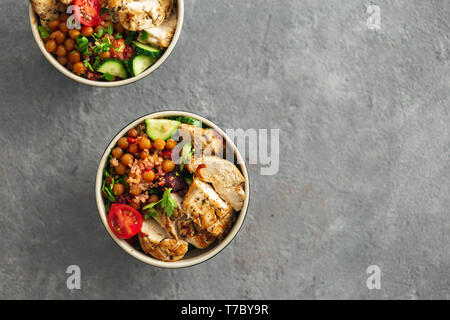 Healthy food bowl buddha top view asian table styling with copy space. Grilled chicken steak with spicy chickpeas, quinoa and baked beetroot Stock Photo