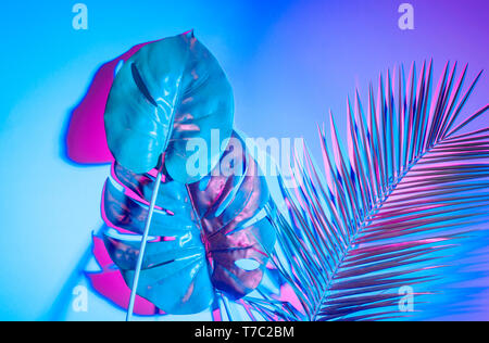 Creative tropic purple leaves layout. Supernatural concept. Flat lay. Ultra violet colors. Stock Photo