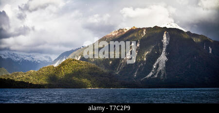Moutainous  largely unihabited forested Patagonian coastline seen from a cruise ship to the San Rafael glacier in southern Chile. Stock Photo
