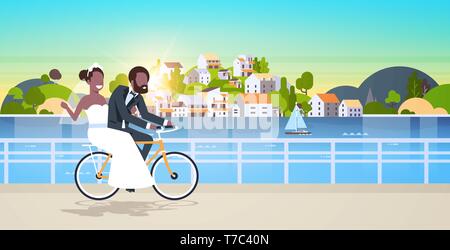 just married man woman riding bicycle romantic african american couple bride groom cycling bike having fun wedding day concept mountain city island Stock Vector