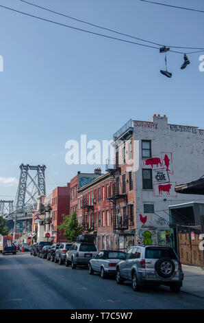 View of the Williamsburg Bridge from the 6th St in the Williamsburg neighborhood. It is a suspension bridge in New York City Stock Photo
