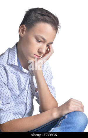 Portrait of sad teenage boy isolated on white background Stock Photo