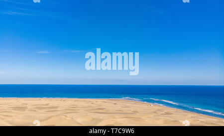 Aerial View of Sand Dunes in Gran Canaria with beautiful coast and beach, Canarian Islands, Spain Stock Photo