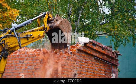 Building demolition with powerful excavator Stock Photo