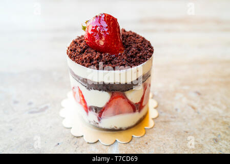 delicious handmade strawberry, vanilla and caramel chocolate cake Stock Photo
