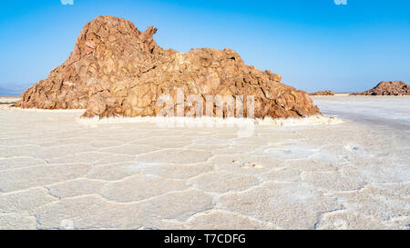 Plain of salt with salty rocks in the Danakil Depression in Ethiopia, Africa. Stock Photo