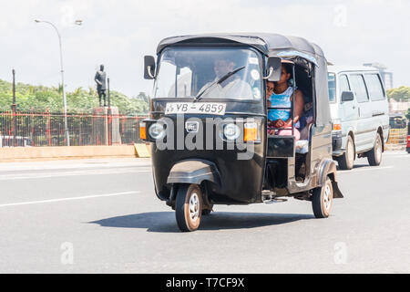 Colombo, Sri Lanka - March 16th 2011: A tuk tuk carrying passengers. This is a cheap way of getting around the city.