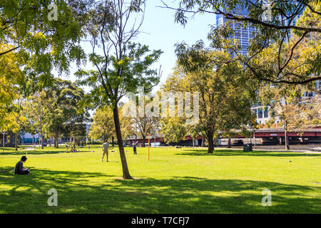 Melbourne, Australia - 20th March 2013: People enjoying the sunshine in Batman Park. The park is on the banks of the River Yarra. Stock Photo