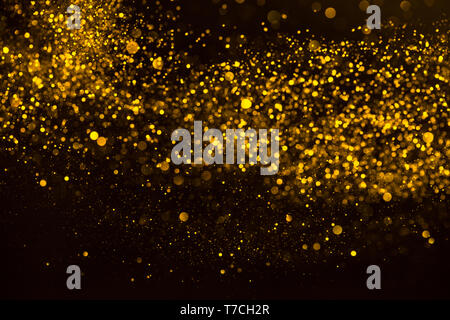 Gold confetti dust rain abstract background Stock Photo