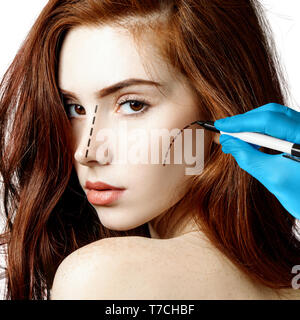 Beautiful woman face with correction lines. Stock Photo