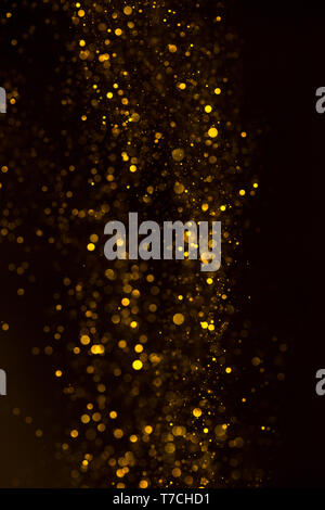 Yellow glitter shiny abstract lights flow background Stock Photo