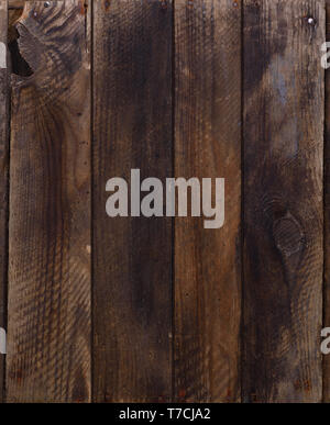 Dark weathered wooden planks with rusty nails background Stock Photo