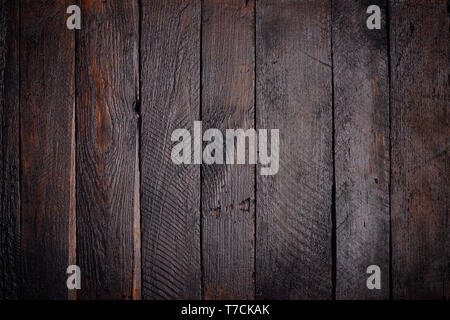 Dark stained wooden planks background Stock Photo