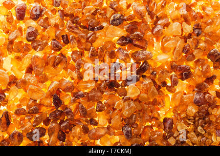Brown sugar crystals macro closeup abstract background Stock Photo