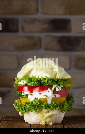 Burger fully vegan big  pure organic vegetable hamburger concept on wooden table still life Stock Photo