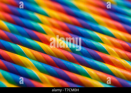 Colorful paper cocktails straws in row abstract background Stock Photo