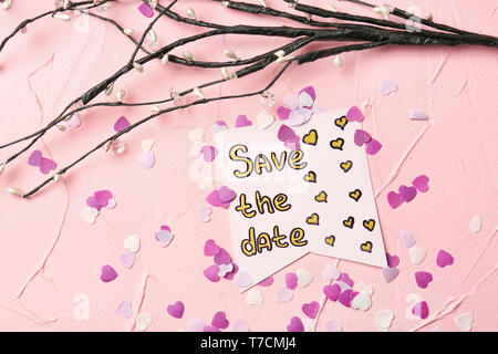 Composition with 'Save the date' card on color background Stock Photo