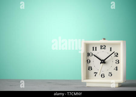 Retro old classic alarm clock vintage color background with copy space Stock Photo