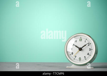 Retro old classic round alarm clock vintage color background with copy space Stock Photo