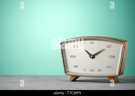 Retro classic wooden alarm clock vintage color background with copy space Stock Photo