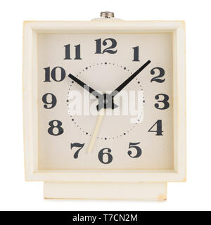 Retro alarm clock white plastic yellowed isolated on white background Stock Photo