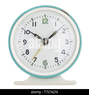 Vintage alarm clock analog in green metal round case isolated on white Stock Photo