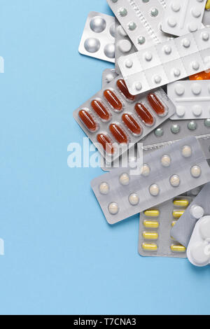 Medicine pills blisters packs heap assortment top view with copy space Stock Photo