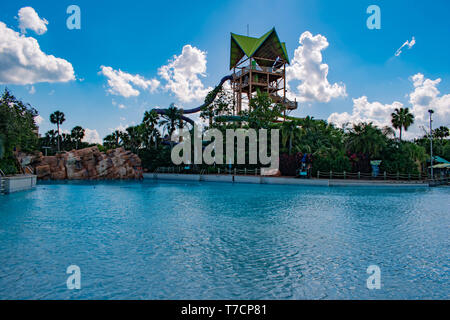 Orlando, Florida. April 26, 2019. Beautiful view of pool and Aquatica Tower on lightblue sky cloudy background in International Drive area. Stock Photo