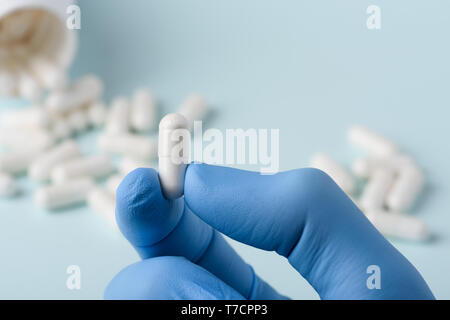 Medical pill capsule in doctor hand new effective cure research concept Stock Photo