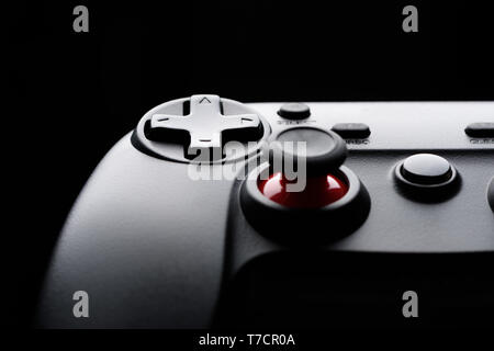 Game pad dark silhouette video game controller macro close-up Stock Photo