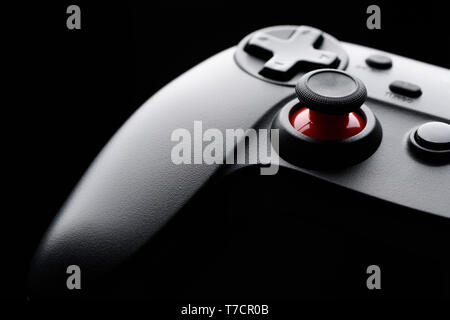 Generic game pad joystick macro closeup on black background Stock Photo