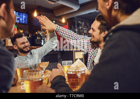 Young people in a meeting in a pub. Stock Photo