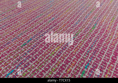 Close up of brightly colored fabric with textile texture Stock Photo