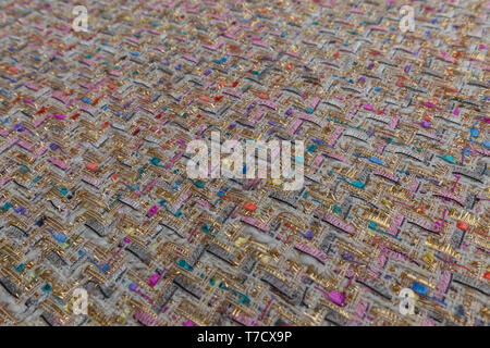 Beautiful colorful fabric with gilded textile texture background Stock Photo