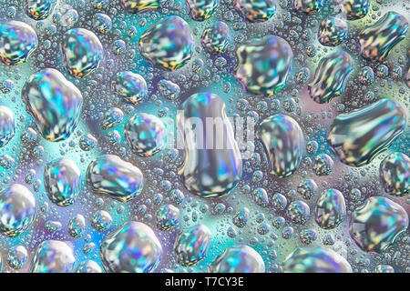 Abstract background of water drops on glass, illuminated by a multi-colored background. Stock Photo