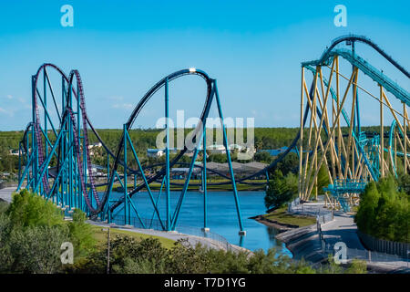 Orlando, Florida. April 20, 2019. Aerial view of Mako and Kraken rollercoasters on lightblue sky background at Seaworld in International Drive area. Stock Photo