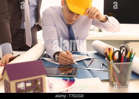 Two Engineer Architect Discussing House Project Stock Photo