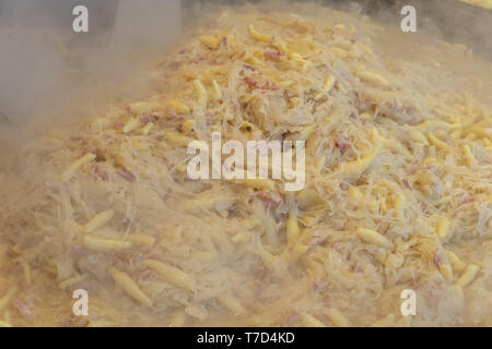 Finger-shaped potato dumplings, Schupfnudeln with cabbage and bacon Stock Photo