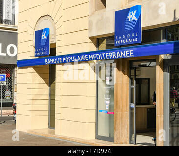 CANNES, FRANCE - APRIL 2019: Signs on the outside of a branch of the Banque Populaire Mediterranee in Cannes. Stock Photo
