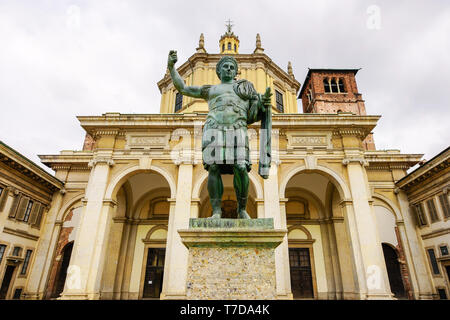 Front view of The Basilica of San Lorenzo Maggiore and Statue of Constantine the Great (copy) in Milan, Lombardy, Italy. Stock Photo